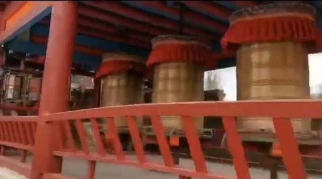 Screenshot of the row of 45 big prayer wheels which contain hundreds of thousands of Buddhist mantras