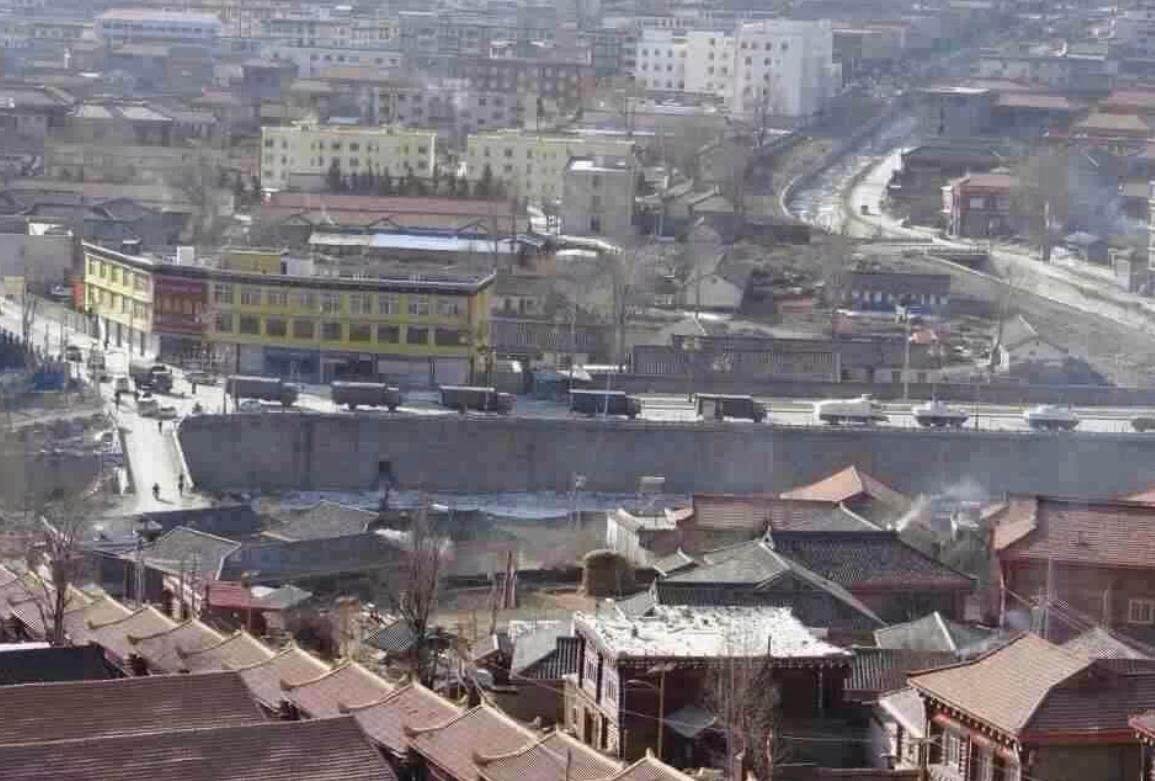 Army trucks in Drago County, January 2012 after mass protests. The prayer wheels building (bottom left) was forcibly demolished in December 2021