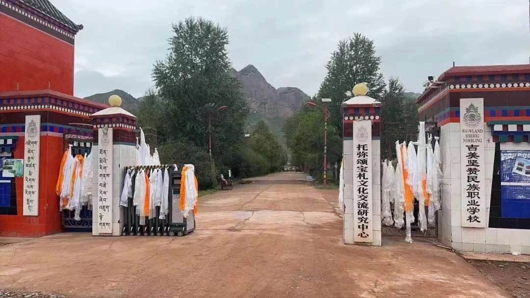 Farewell khatas at the entrance gate of Ragya Gangjong Sherig Norbu Ling after its forced closure