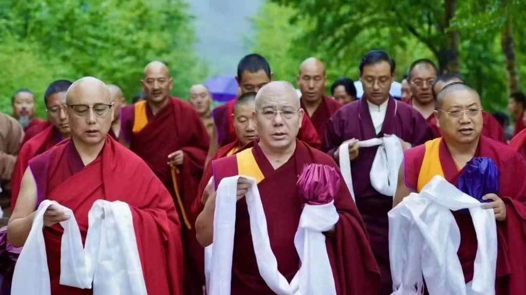 Leading staff of Ragya school with their farewell khata on school closure day. From left: Tsultrim Gyatso, Jigme Gyaltsen, and Dhong Yonten Gyatso