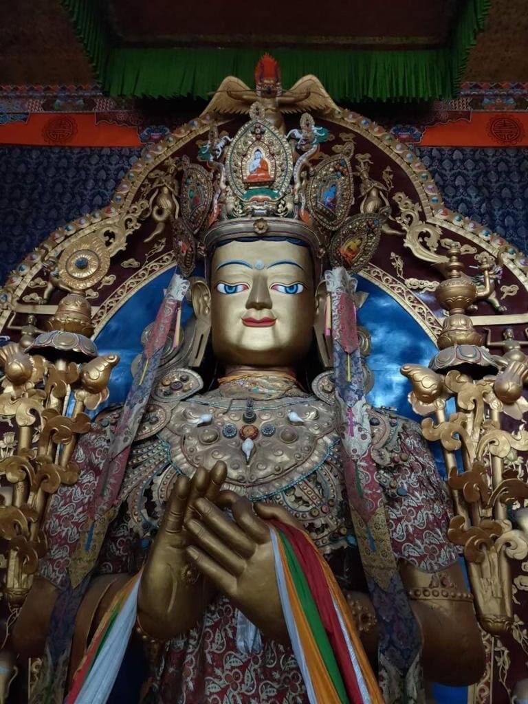 The three-storey high statue of Maitreya Buddha before demolition