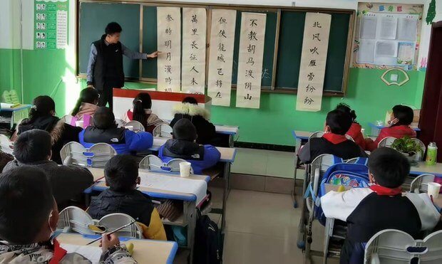 Students learning Chinese in a classroom in Golog