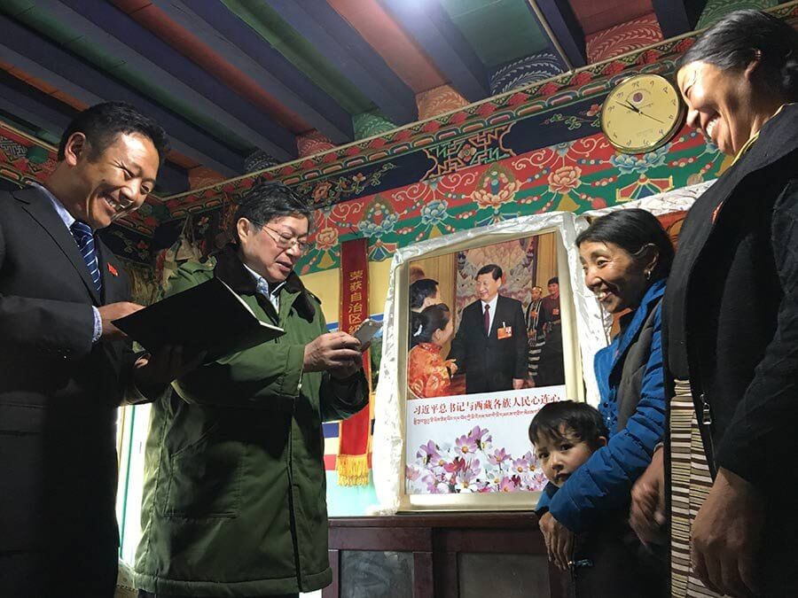 A photo from 2017 showing portrait of Xi Jinping hanging in a Tibetan home in Lhuntse County, Tibet Autonmous Region