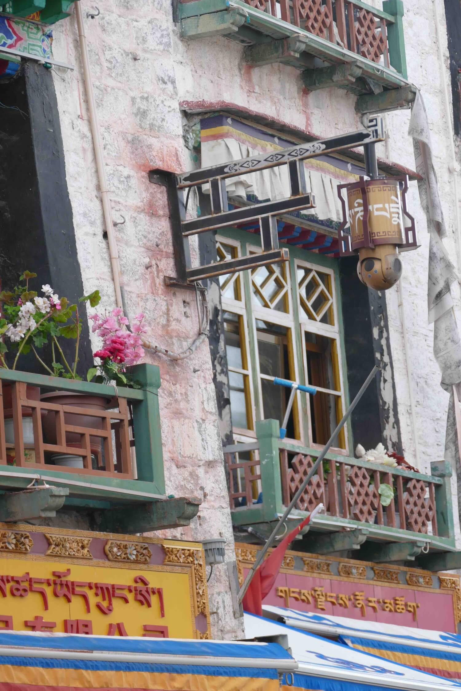 Surveillance camera in a prayer wheel, Barkor, Lhasa, 2017