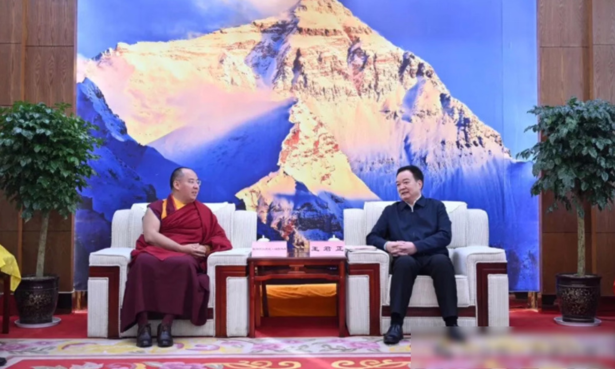 These images from Chinese state media depict Tibet Autonomous Region Party chief Wang Junzheng with the Chinese Panchen Lama Gyaltsen Norbu, and having an exchange with monks and officials over "the strengthening and innovation of monastery management".