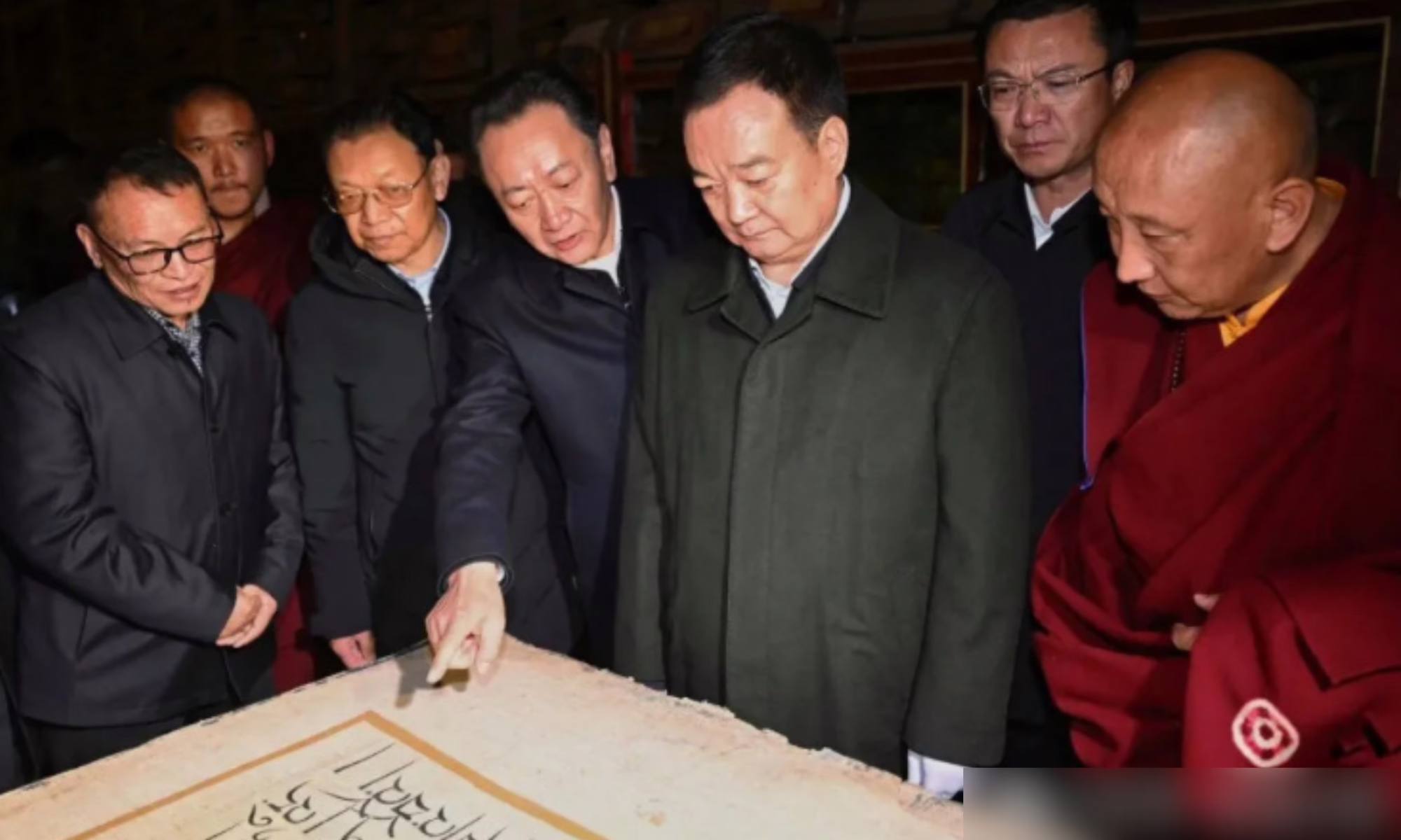 These images from Chinese state media depict Tibet Autonomous Region Party chief Wang Junzheng with the Chinese Panchen Lama Gyaltsen Norbu, and having an exchange with monks and officials over "the strengthening and innovation of monastery management".