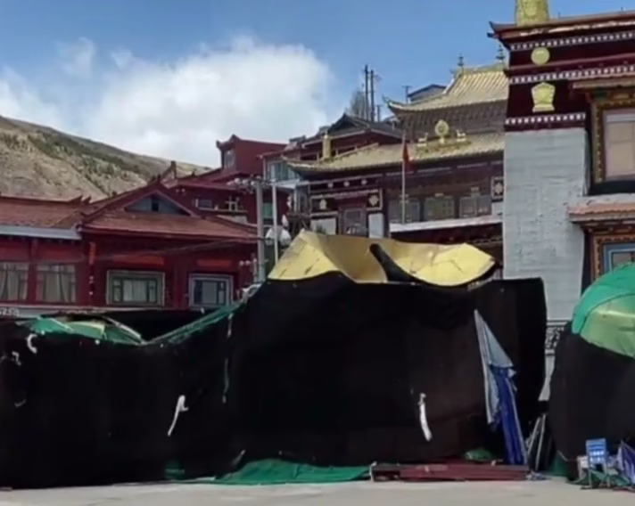 Broken sections of a Maitreya Buddha statue at the entrance of Drago Monastery Image received in February 2023